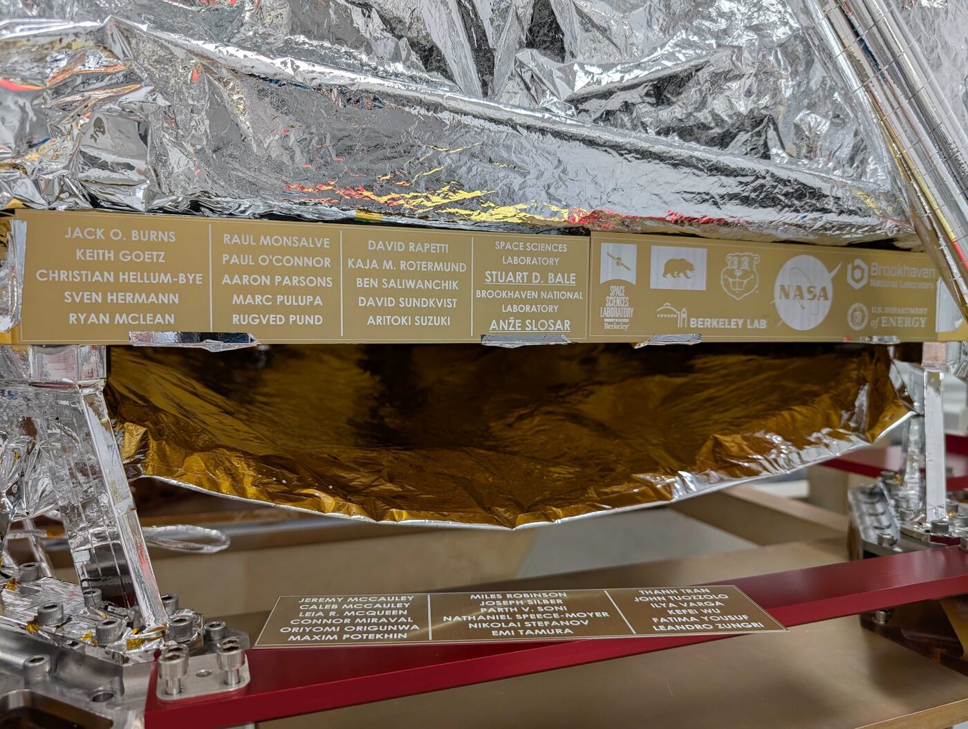 Gold team plaque bolted to the LuSEE-Night flight instrument, listing the names of the people who built it